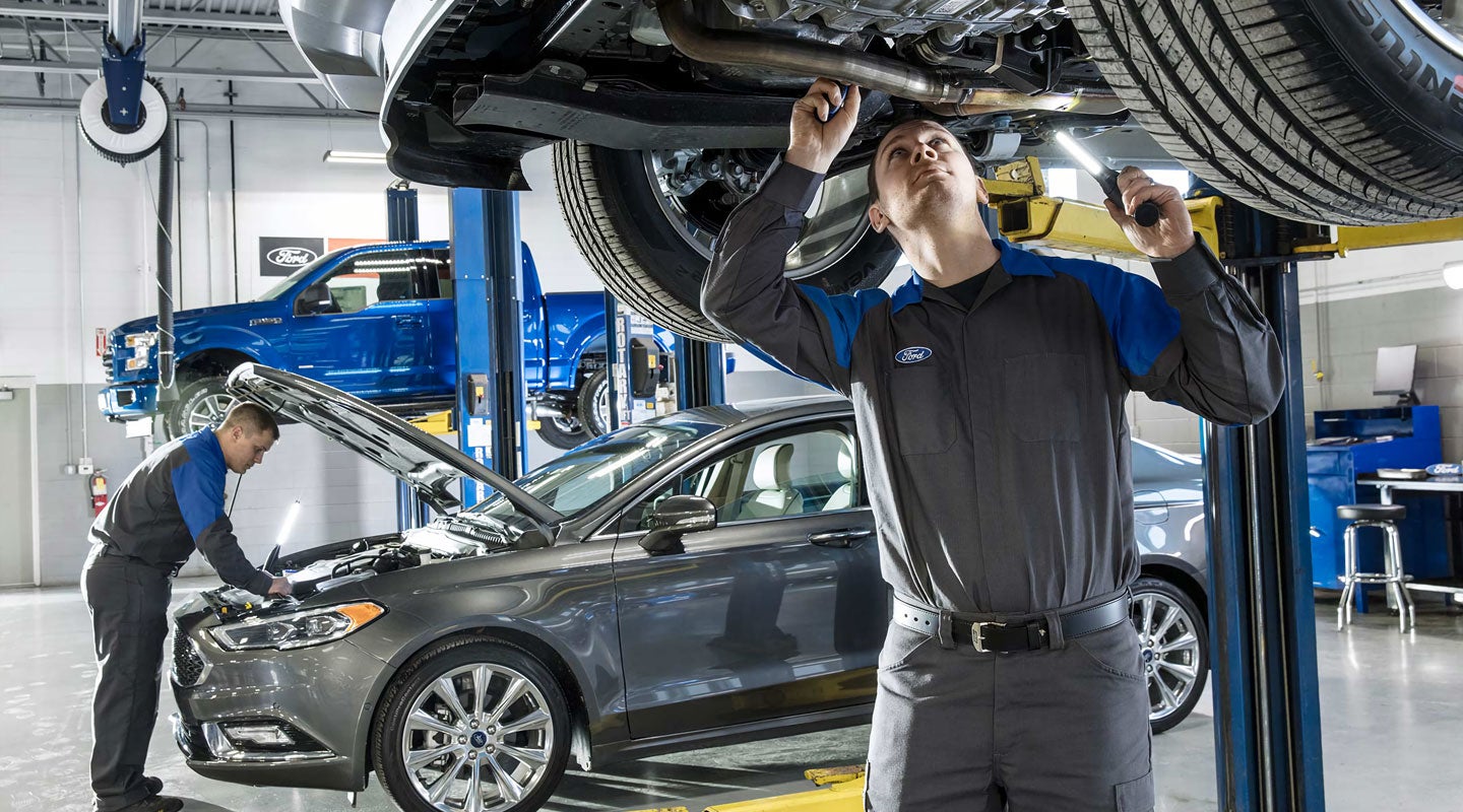 Ford Certified mechanics inspecting vehicles